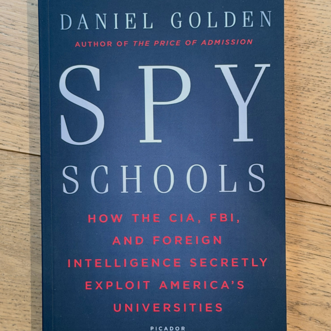 Book cover of 'Spy Schools' by Daniel Golden, featuring a dark blue background and white text.